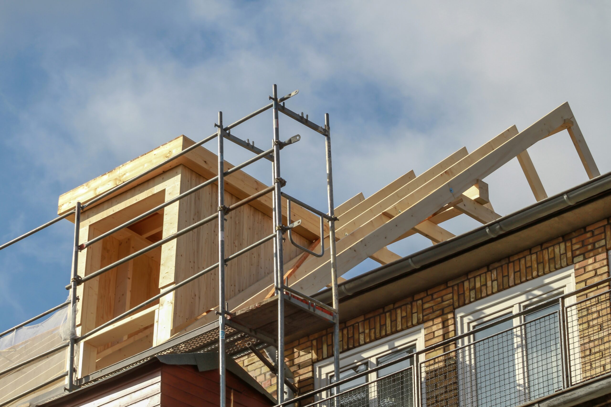 Dormer,Installation,On,The,Rooftop,Of,A,Apartment,House